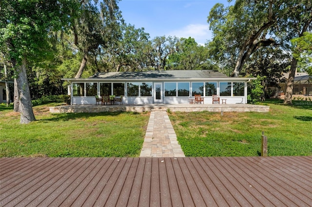 900 NW Snug Harbor Rd, Crystal River, FL 34428 - rear view of property featuring a patio area, a lawn, and a deck