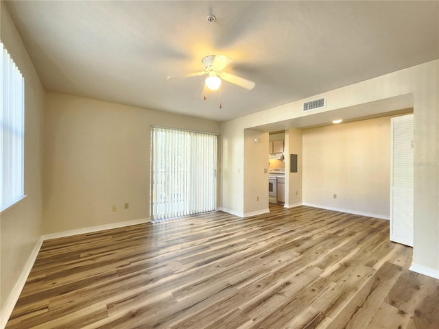 2360 SW Archer Rd Unit 208, Gainesville, FL 32608 - unfurnished living room featuring light wood-type flooring and a ceiling fan