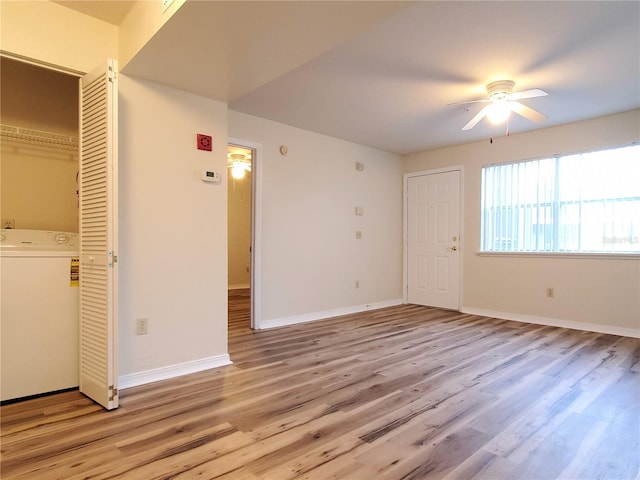 2360 SW Archer Rd Unit 208, Gainesville, FL 32608 - spare room featuring washer / dryer, ceiling fan, and light wood-style floors