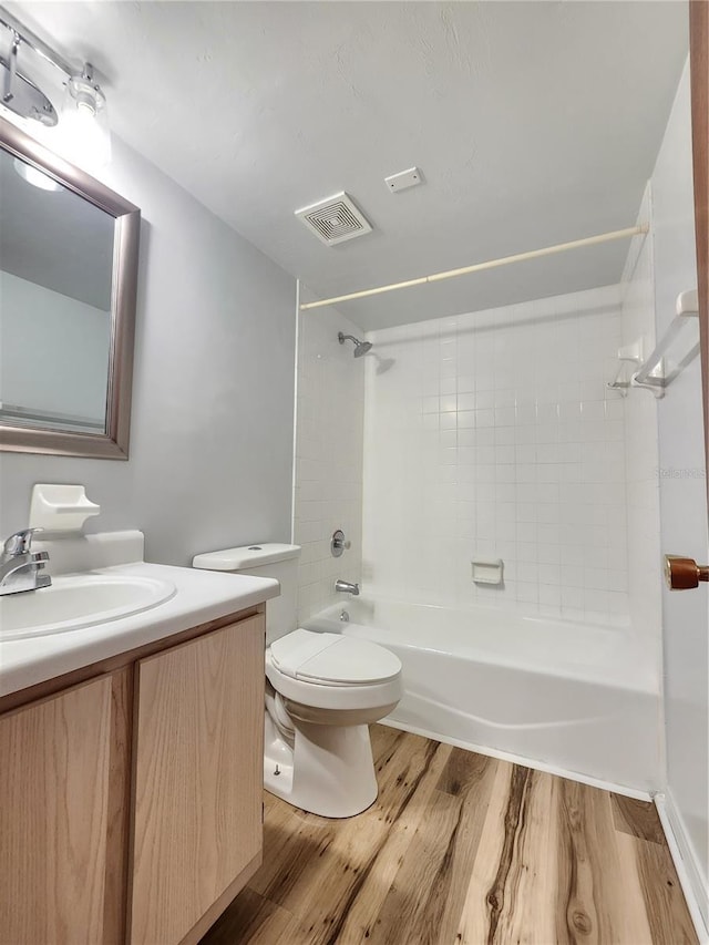 2360 SW Archer Rd Unit 208, Gainesville, FL 32608 - full bathroom with shower / bath combination, wood finished floors, and vanity