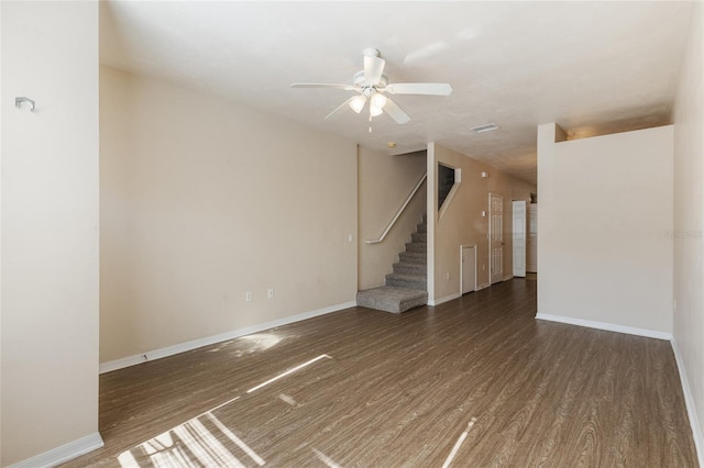 3901 SW 20th Ave Unit 806, Gainesville, FL 32607 - spare room featuring wood finished floors, ceiling fan, and stairs