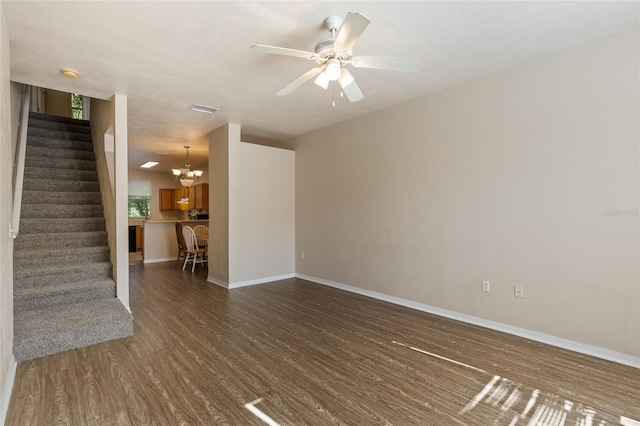3901 SW 20th Ave Unit 806, Gainesville, FL 32607 - unfurnished living room featuring dark wood-style floors, stairway, and a ceiling fan