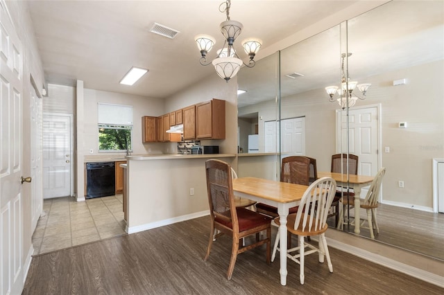 3901 SW 20th Ave Unit 806, Gainesville, FL 32607 - dining space with a chandelier and wood finished floors