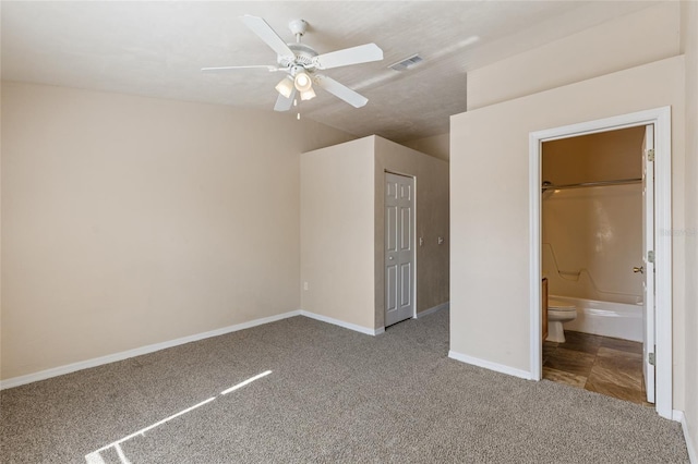 3901 SW 20th Ave Unit 806, Gainesville, FL 32607 - unfurnished bedroom featuring carpet, vaulted ceiling, ensuite bathroom, and ceiling fan