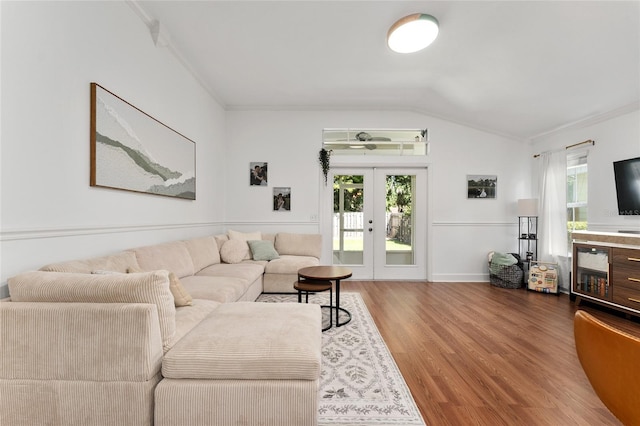 11752 NW 61st Ter, Alachua, FL 32615 - living area featuring wood finished floors, french doors, ornamental molding, and lofted ceiling