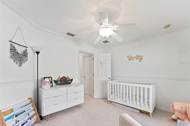 11752 NW 61st Ter, Alachua, FL 32615 - bedroom featuring ornamental molding, a nursery area, light colored carpet, and ceiling fan