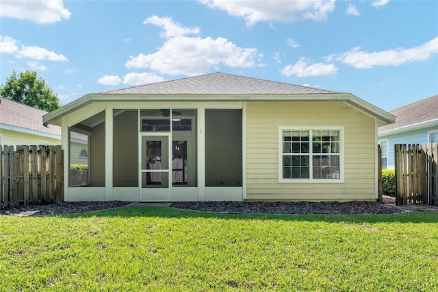 11752 NW 61st Ter, Alachua, FL 32615 - rear view of house featuring a sunroom and roof with shingles