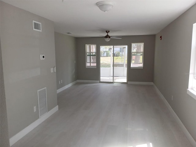 6519 W Newberry Rd Unit 404, Gainesville, FL 32605 - empty room featuring light wood-type flooring and ceiling fan