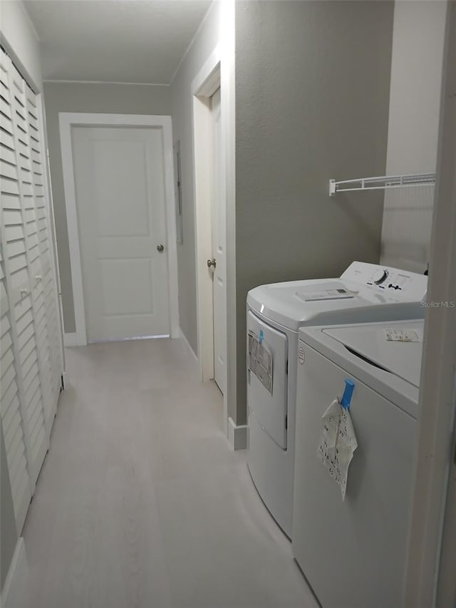 6519 W Newberry Rd Unit 404, Gainesville, FL 32605 - washroom with washer and clothes dryer and light carpet