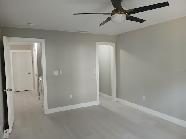 6519 W Newberry Rd Unit 404, Gainesville, FL 32605 - unfurnished room featuring a ceiling fan and independent washer and dryer