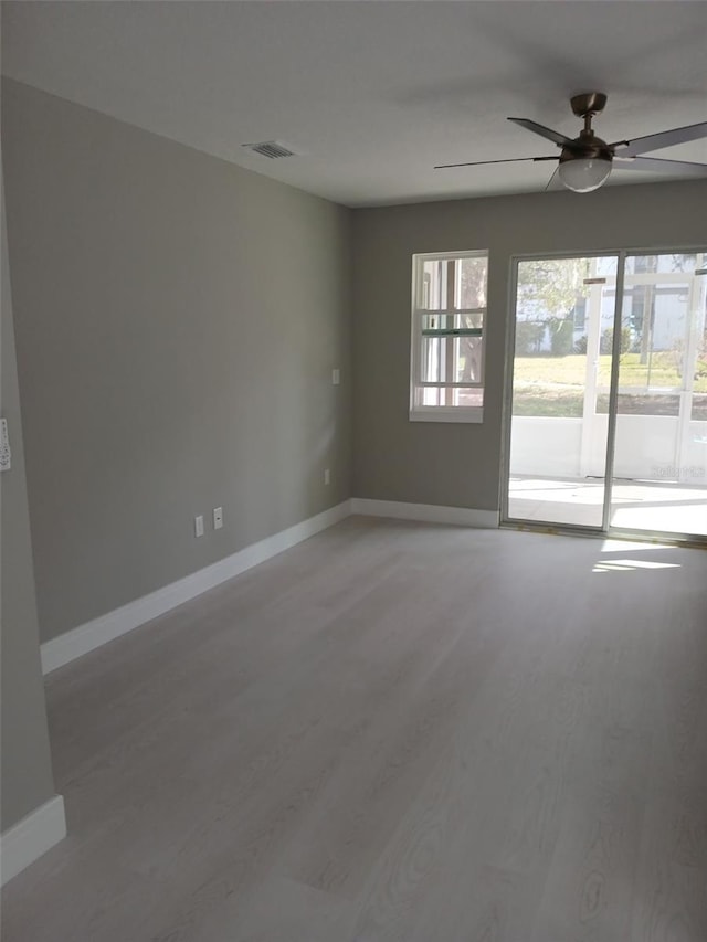 6519 W Newberry Rd Unit 404, Gainesville, FL 32605 - spare room featuring a ceiling fan and light wood finished floors