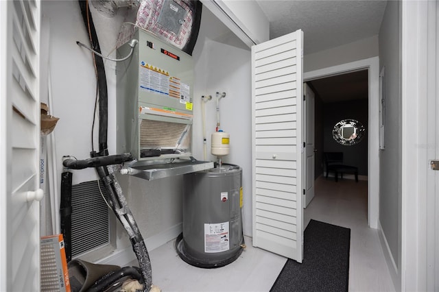 6519 W Newberry Rd Unit 404, Gainesville, FL 32605 - utility room featuring electric water heater