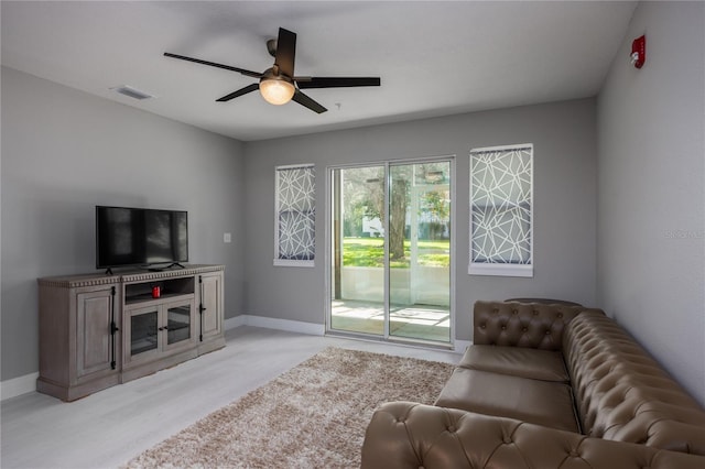 6519 W Newberry Rd Unit 404, Gainesville, FL 32605 - living area featuring ceiling fan and light wood-style floors