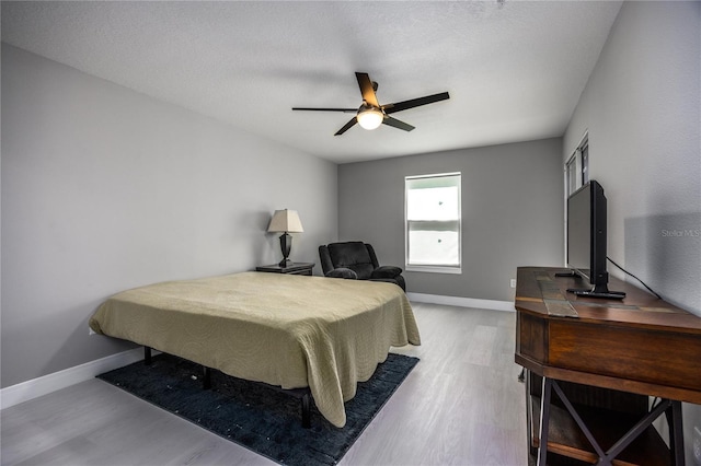 6519 W Newberry Rd Unit 404, Gainesville, FL 32605 - bedroom featuring wood finished floors and ceiling fan