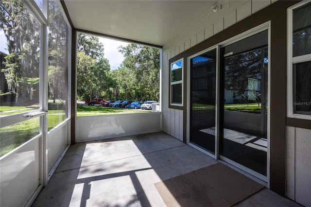 6519 W Newberry Rd Unit 404, Gainesville, FL 32605 - unfurnished sunroom featuring plenty of natural light