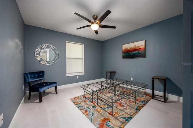 6519 W Newberry Rd Unit 404, Gainesville, FL 32605 - living area with wood finished floors and a ceiling fan