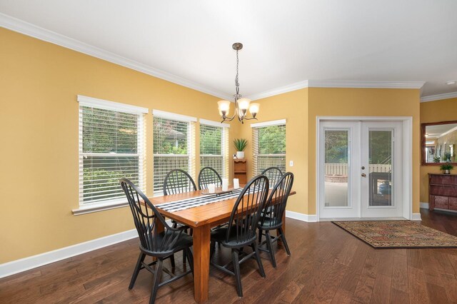 7827 SW 79th Dr, Gainesville, FL 32608 - dining area featuring a chandelier, crown molding, dark wood-style floors, and french doors