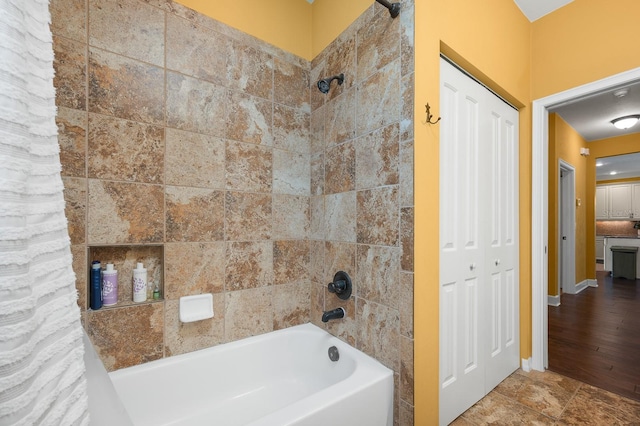 7827 SW 79th Dr, Gainesville, FL 32608 - bathroom featuring shower / bath combo with shower curtain
