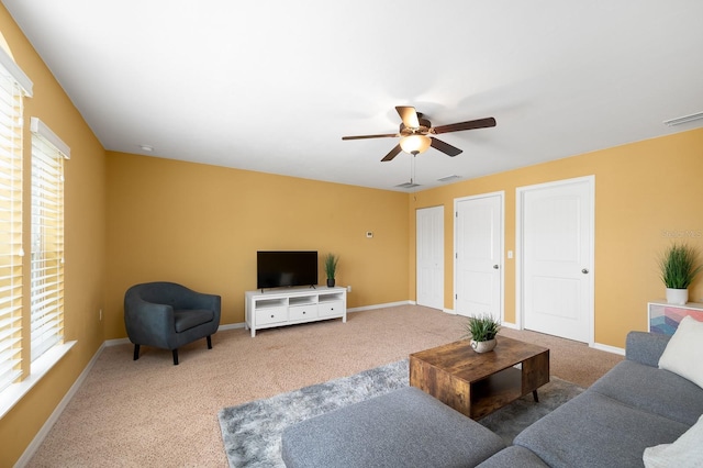 7827 SW 79th Dr, Gainesville, FL 32608 - living room with a ceiling fan, carpet flooring, and plenty of natural light