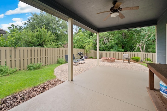 7827 SW 79th Dr, Gainesville, FL 32608 - fenced backyard featuring ceiling fan, an outdoor fire pit, and a patio area