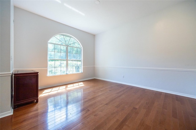 2013 SW 76th Ter, Gainesville, FL 32607 - unfurnished room featuring wood finished floors and lofted ceiling