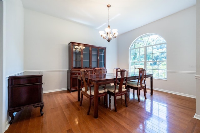 2013 SW 76th Ter, Gainesville, FL 32607 - dining room with a chandelier and wood finished floors