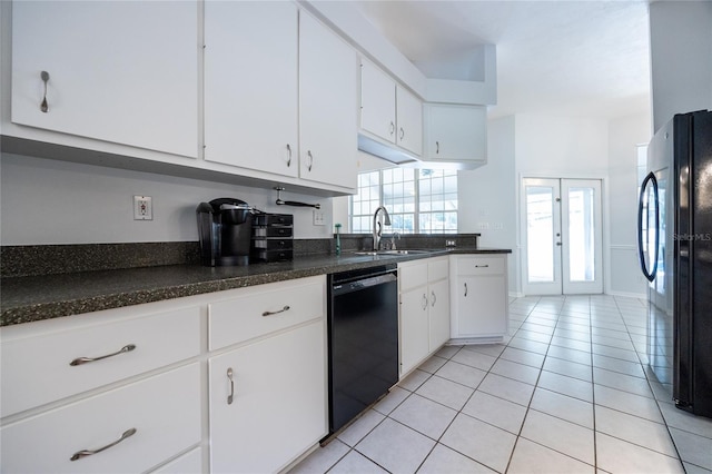 2013 SW 76th Ter, Gainesville, FL 32607 - kitchen featuring black appliances, light tile patterned floors, white cabinetry, and dark countertops