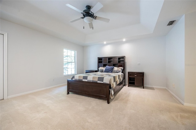 2013 SW 76th Ter, Gainesville, FL 32607 - bedroom featuring light colored carpet, a raised ceiling, and a ceiling fan