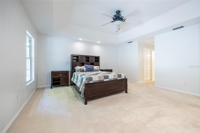 2013 SW 76th Ter, Gainesville, FL 32607 - bedroom featuring a raised ceiling, light carpet, multiple windows, and recessed lighting