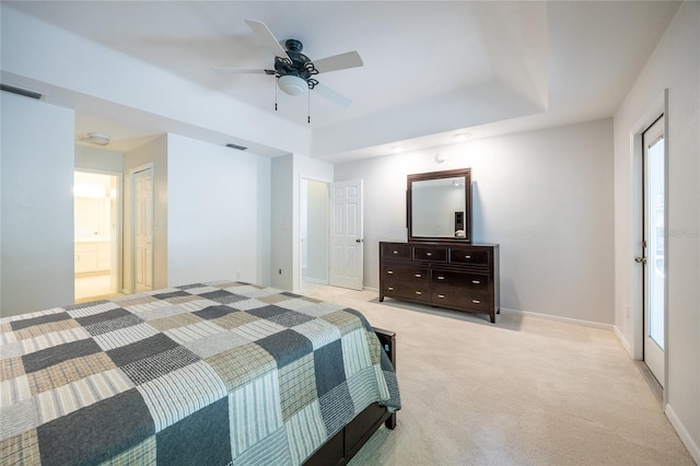 2013 SW 76th Ter, Gainesville, FL 32607 - carpeted bedroom with a tray ceiling and a ceiling fan
