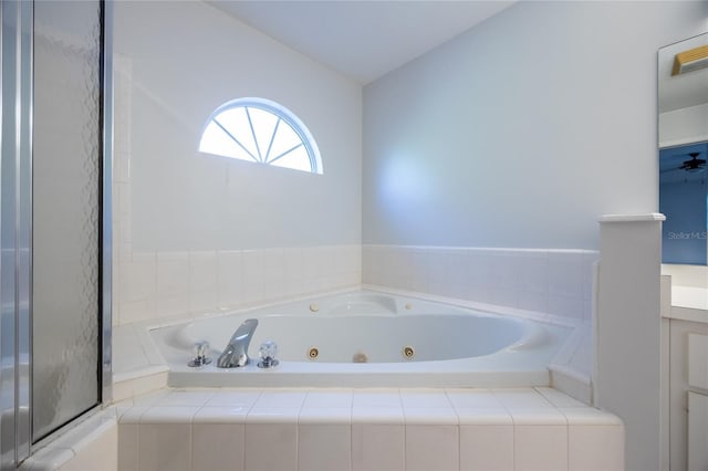 2013 SW 76th Ter, Gainesville, FL 32607 - full bath featuring a tub with jets, lofted ceiling, and vanity