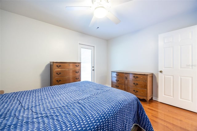 2013 SW 76th Ter, Gainesville, FL 32607 - bedroom with light wood finished floors and a ceiling fan