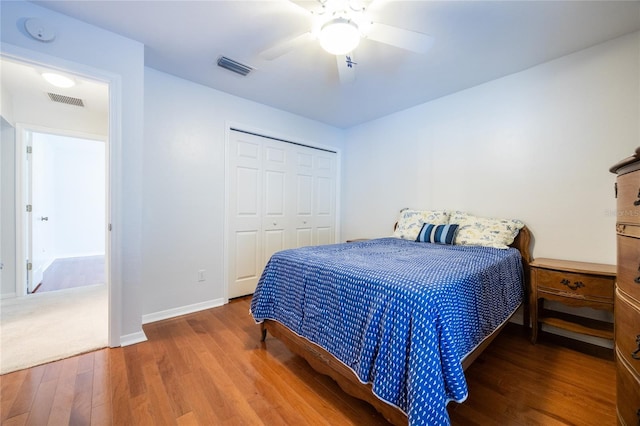2013 SW 76th Ter, Gainesville, FL 32607 - bedroom with wood finished floors, a closet, and ceiling fan
