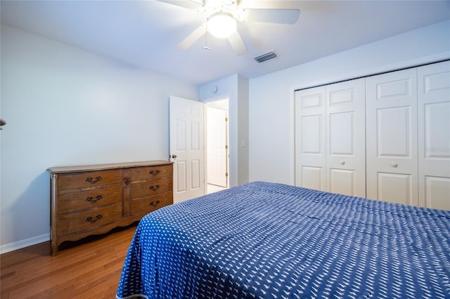 2013 SW 76th Ter, Gainesville, FL 32607 - bedroom with wood finished floors, a closet, and ceiling fan