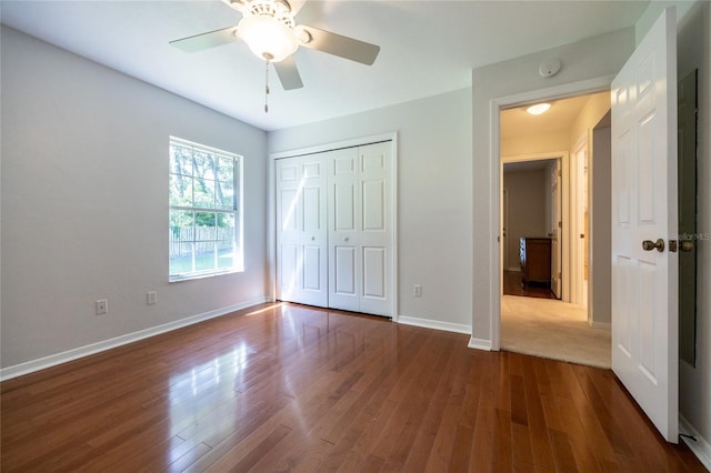 2013 SW 76th Ter, Gainesville, FL 32607 - unfurnished bedroom with wood finished floors, a closet, and ceiling fan