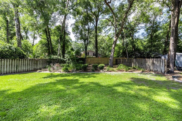 2013 SW 76th Ter, Gainesville, FL 32607 - fenced backyard featuring view of wooded area