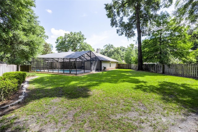 2013 SW 76th Ter, Gainesville, FL 32607 - fenced backyard featuring glass enclosure