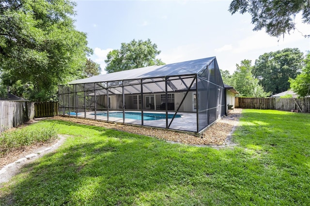 2013 SW 76th Ter, Gainesville, FL 32607 - view of swimming pool with a fenced backyard and glass enclosure