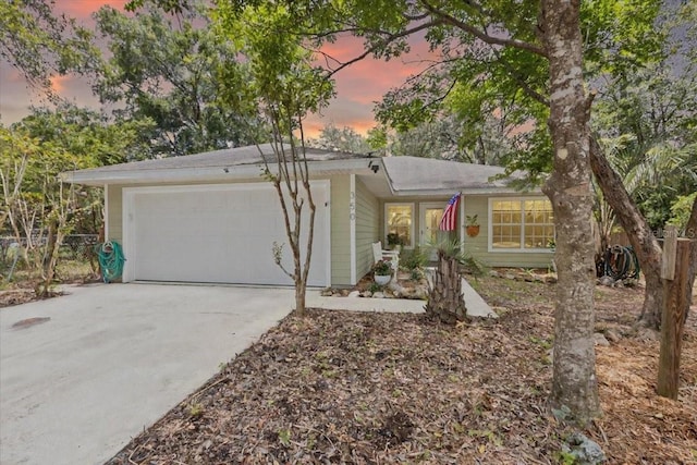 350 Hardee St, Bronson, FL 32621 - view of front of home with a garage and driveway
