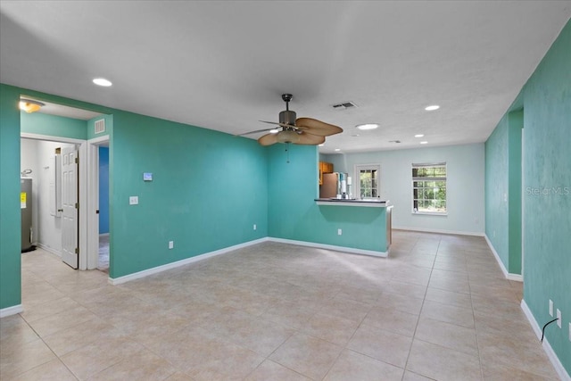 350 Hardee St, Bronson, FL 32621 - unfurnished room with a ceiling fan, light tile patterned floors, recessed lighting, and electric water heater