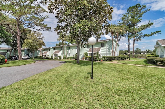 487 Midway Dr Unit B, Ocala, FL 34472 - view of front facade with a front lawn