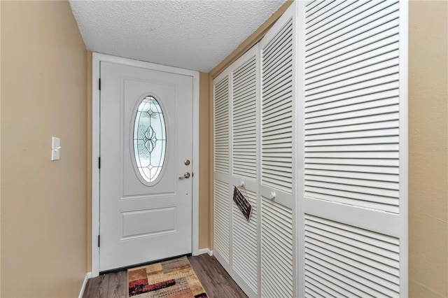 487 Midway Dr Unit B, Ocala, FL 34472 - foyer entrance with a textured ceiling and dark wood finished floors