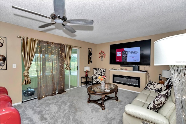 487 Midway Dr Unit B, Ocala, FL 34472 - living room with a textured ceiling, carpet flooring, a ceiling fan, and a glass covered fireplace
