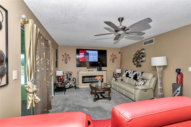 487 Midway Dr Unit B, Ocala, FL 34472 - living room with ceiling fan, carpet, and a textured ceiling