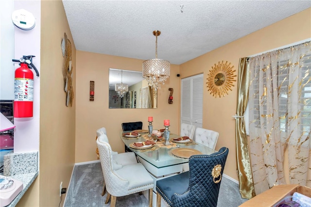 487 Midway Dr Unit B, Ocala, FL 34472 - dining room with carpet floors, a chandelier, and a textured ceiling
