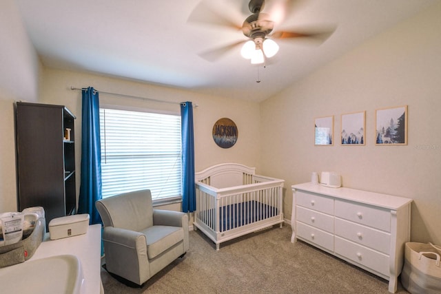 3735 NW 64th Pl, Gainesville, FL 32653 - carpeted bedroom with vaulted ceiling, a crib, and ceiling fan