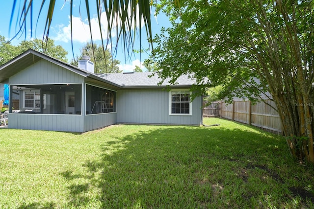 3735 NW 64th Pl, Gainesville, FL 32653 - back of property with a sunroom and a chimney