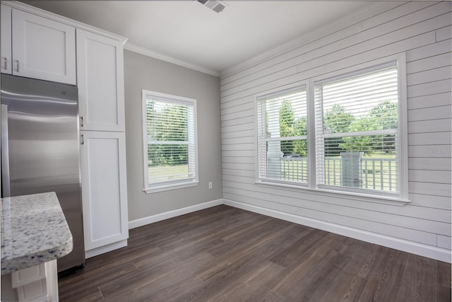 16011 S County Road 325, Hawthorne, FL 32640 - unfurnished dining area with crown molding, wooden walls, and dark wood-style flooring