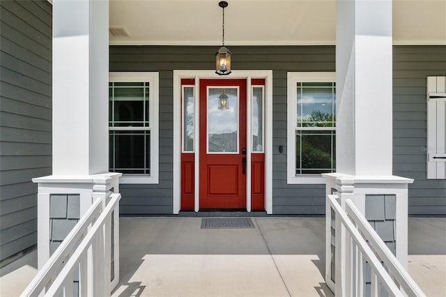 2556 SW 118th Ter, Gainesville, FL 32608 - doorway to property featuring a porch