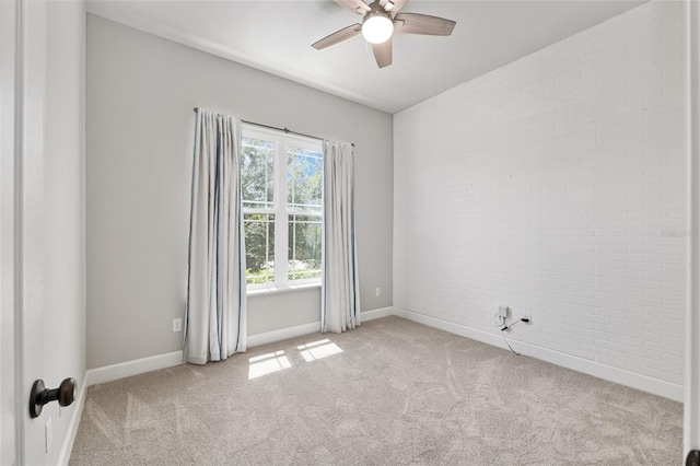 2556 SW 118th Ter, Gainesville, FL 32608 - carpeted empty room with a ceiling fan and brick wall